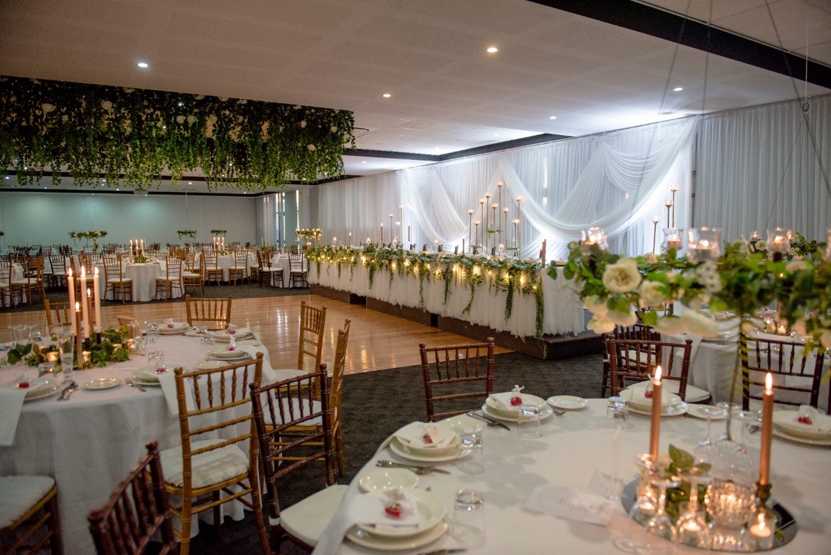 Wedding reception layout in The Gallery with round tables, dancefloor and bridal table