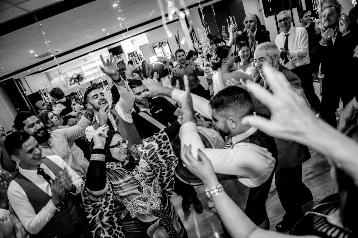 Guests dancing together at a wedding reception